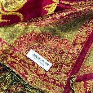Beautiful 100% Pashmina scarf.  It is a rich regal red & gold with fringe.